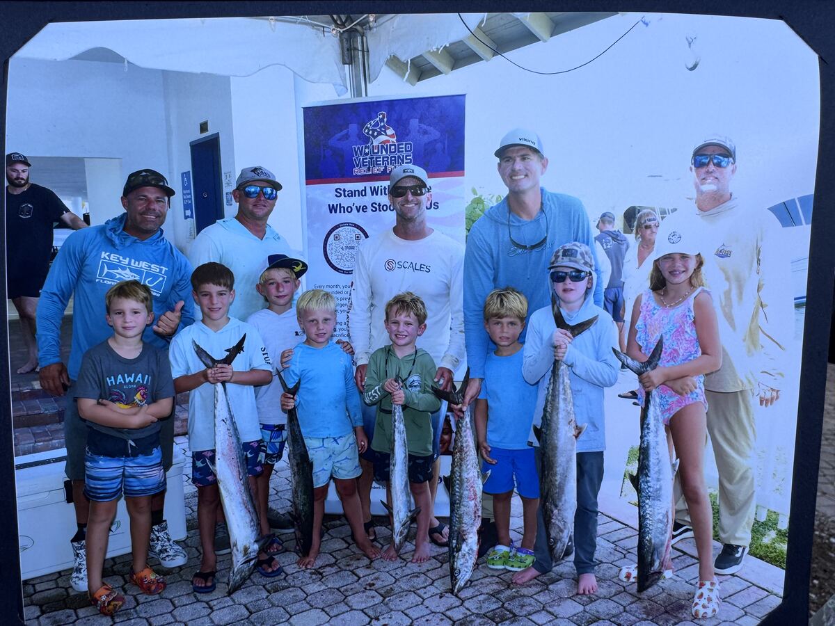 Tournament anglers with kingfish and wahoo catches